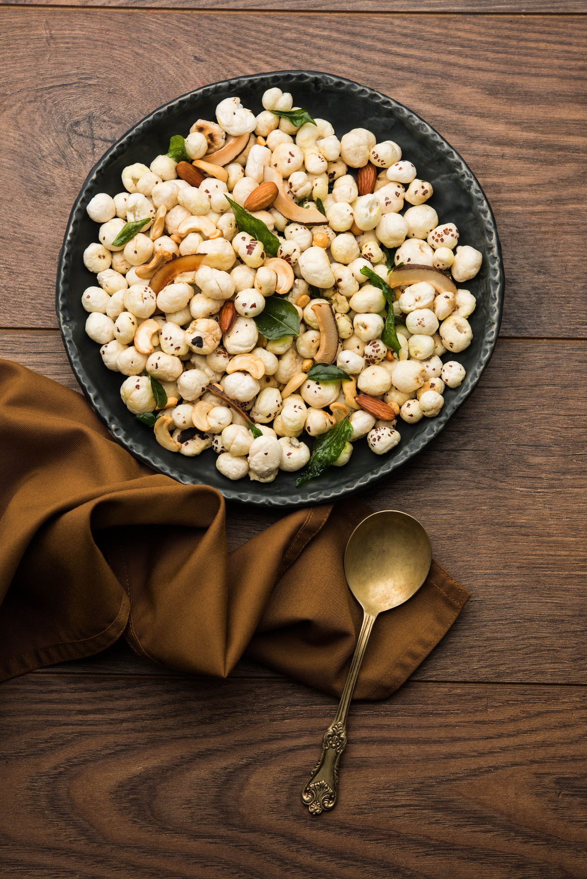 Phool Makhana Chivda is a crunchy healthy snack from india, perfect for teatime. Served in a bowl or plate. Selective focus